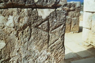 labrys carved on stone
