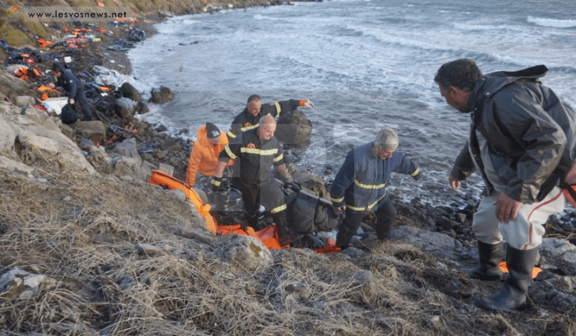 A father watches helplessly as his dead child is pulled from the sea.