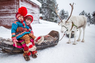 Sami children with reindeer