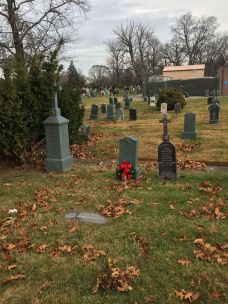 most-holy-trinity-cemetery-with-grave-of-george-and-fred-white-carnations