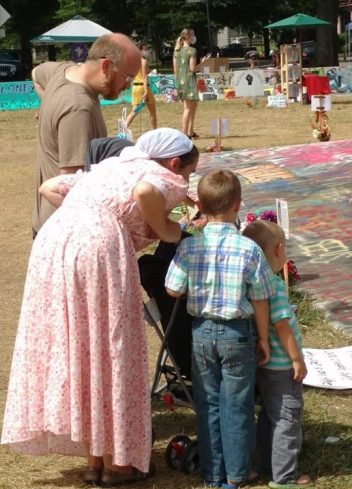 Parents reading each of the 34 memorials and explaining them to their 4 children