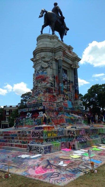 Back of Robert E. Lee statue showing placement of a couple of memorials to the many Black people killed by police