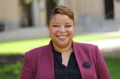 An image of Elise Edwards smiling outdoors